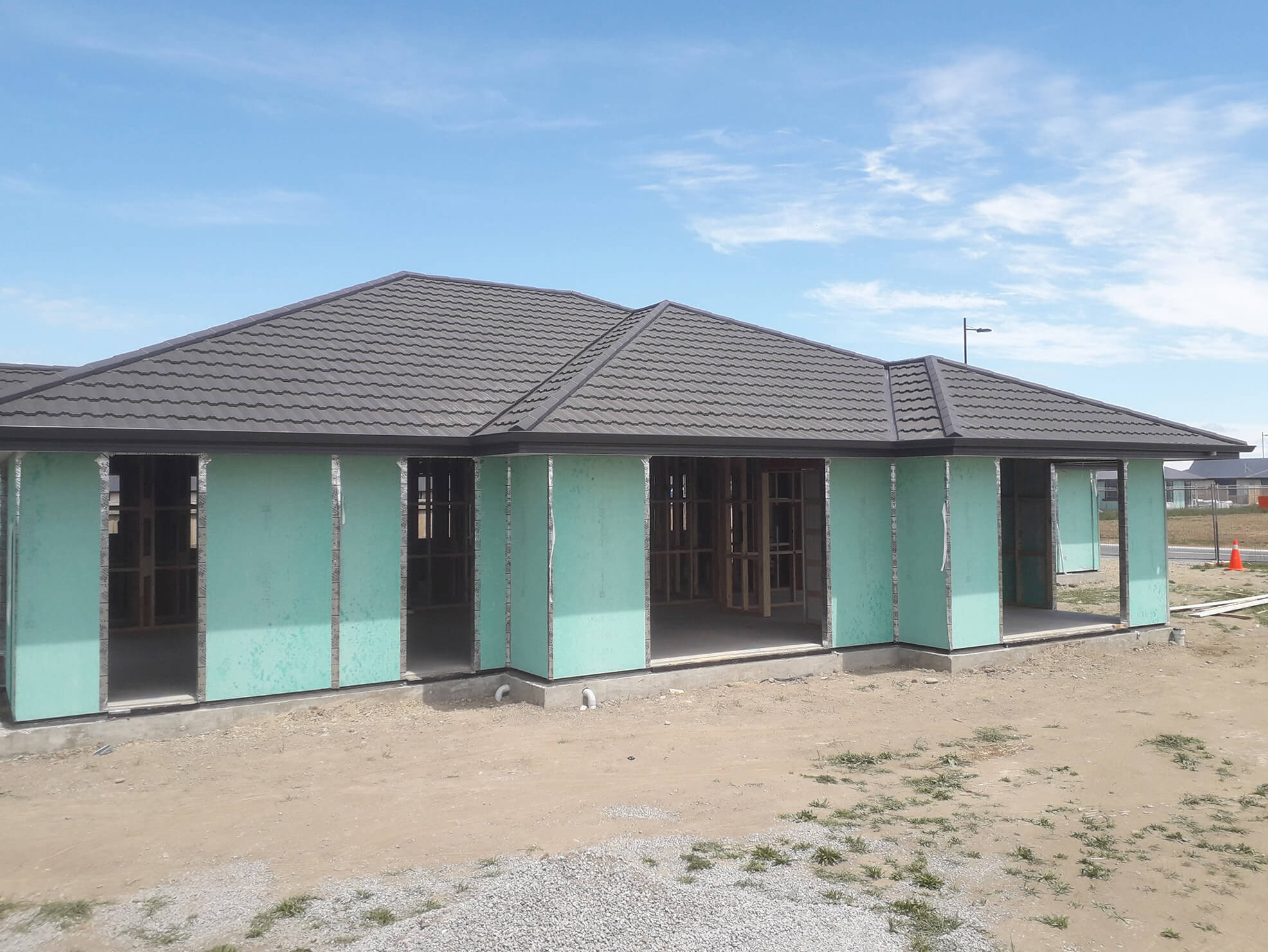 New build house with finished metal tile roof