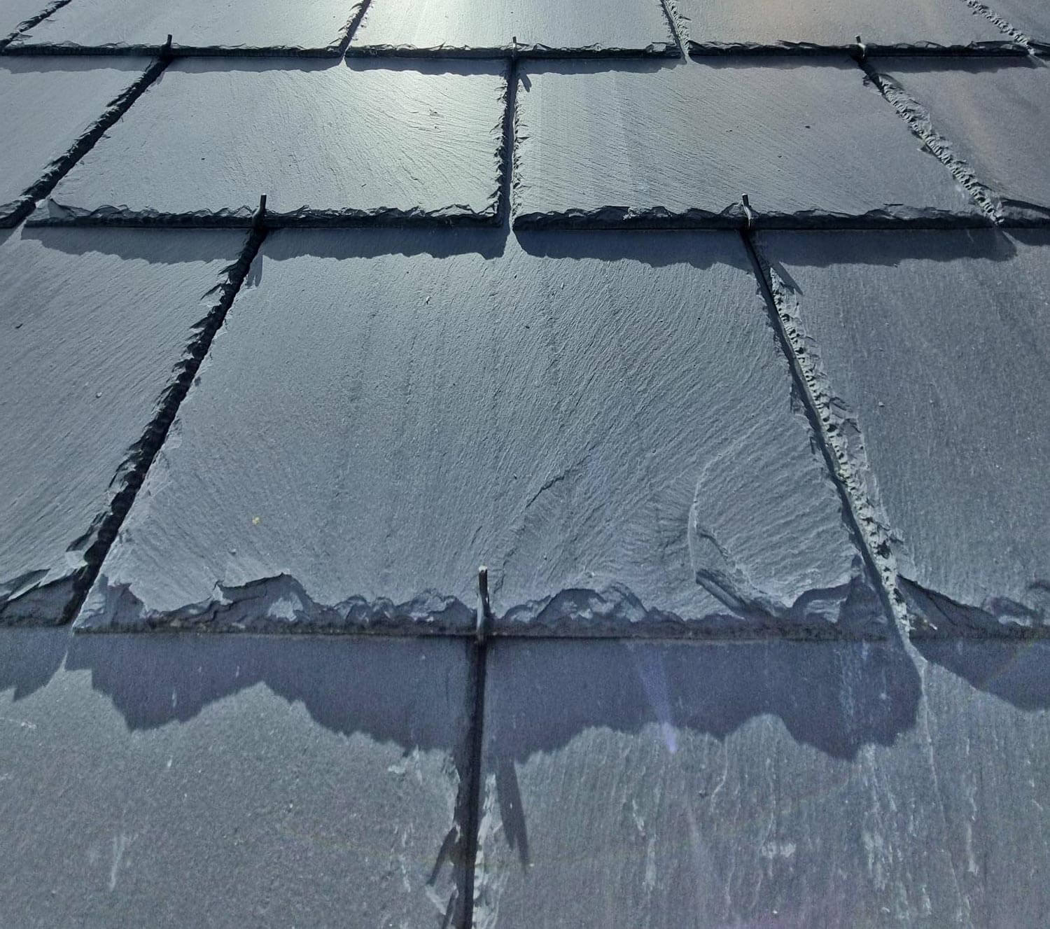 Closeup of slate tile roof showing the hook fix technique